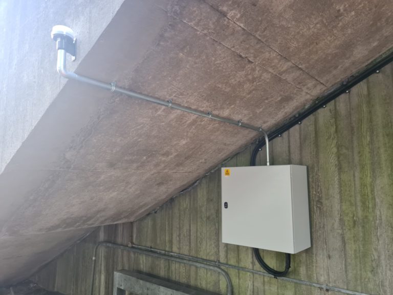 Galvanised conduit and flexible metal conduit installed Photocell