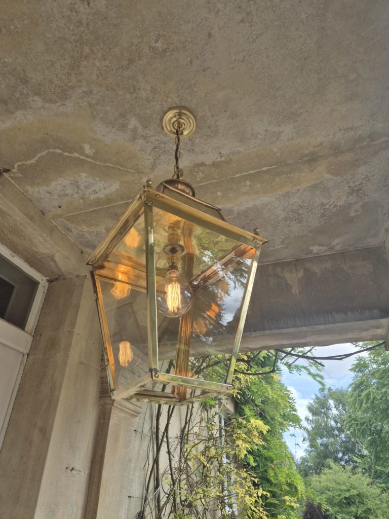 antique copper lantern in house entrance