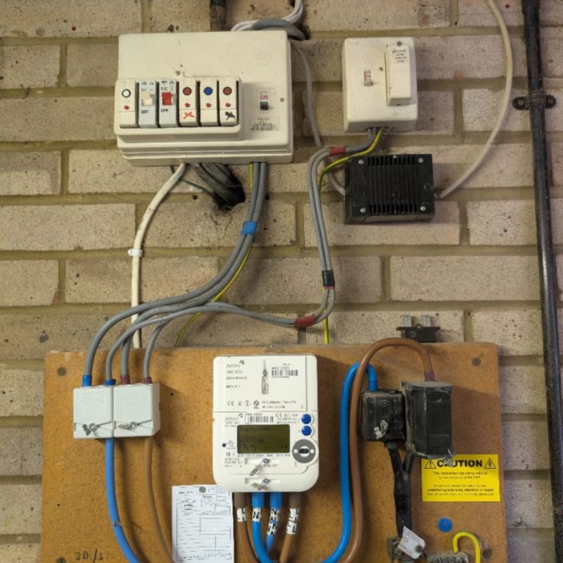 The original consumer unit and meter, before any of the work started