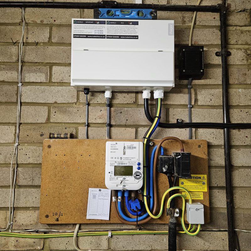 New consumer unit in place above the meter, tails and earth run in
