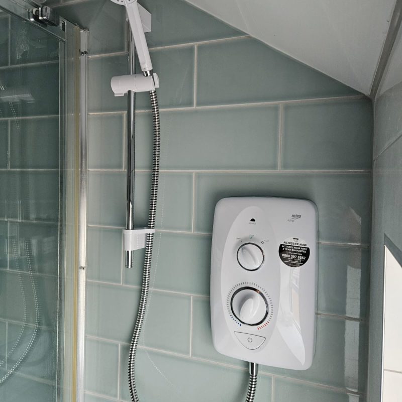Finished installation under the sloped ceiling of the shower room