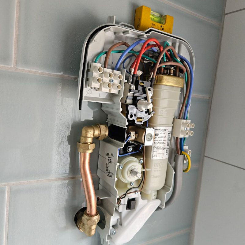 Cover off, with the heater canister and solenoid visible
