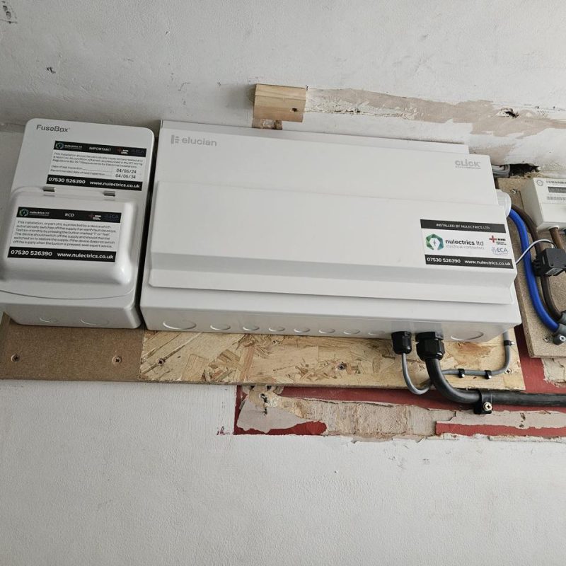 The EV board sits alongside the existing house consumer unit and meter