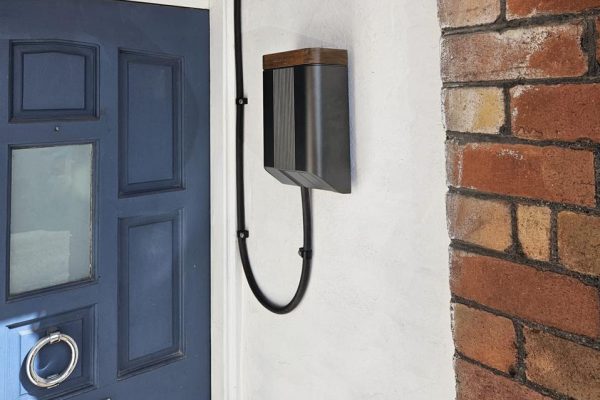 Untethered charger with walnut lid, set into the porch reveal