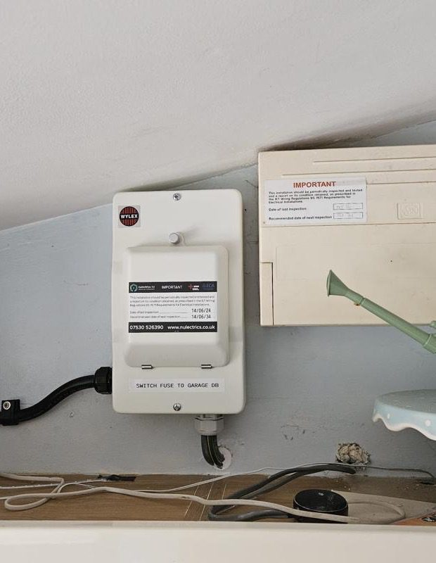 New switch fuse next to the house board, labelled for the garage